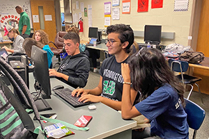 UCVirtual students in lab working